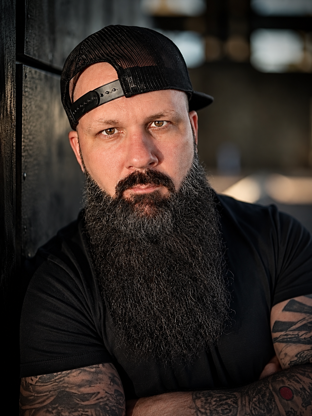 Portrait of Rob Benton in a black shirt and backwards cap